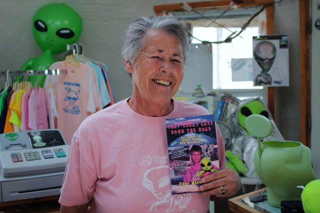Judy Messoline shows off her book