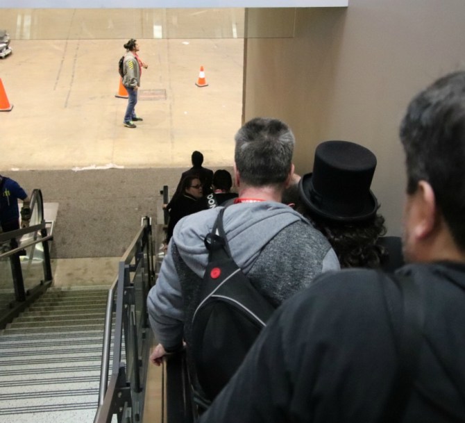 TV horror host, Svengoolie, goes down an elevator to main convention floor