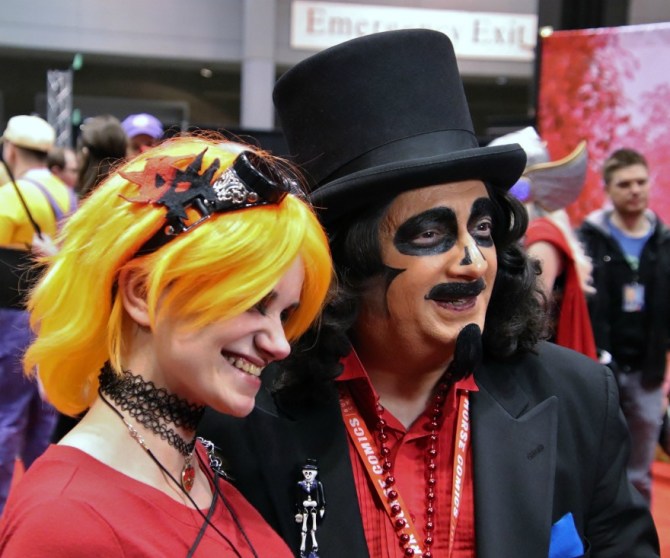 TV horror host, Svengoolie, posing with girl at Cosplay Central