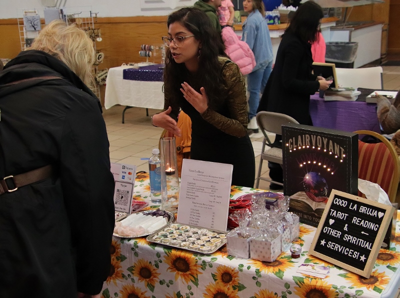 Vendor with a customer at Chicago Paranormal Conference